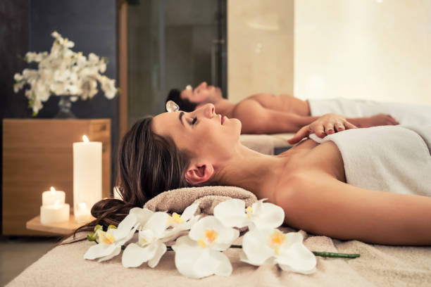 istock Man relaxing with his partner on massage beds at wellness center 875636562