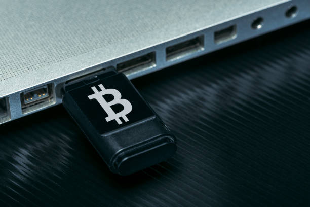 Cryptocurrency Usb stick with bitcoin logo. Cryptocurrency concept. usb port photos stock pictures, royalty-free photos & images