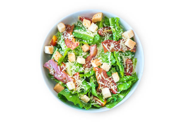 istock Caesar Salad with Cheese and Bacon on a wooden table. 875640806