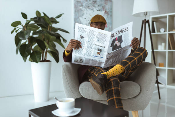 istock man reading business newspaper 875641218