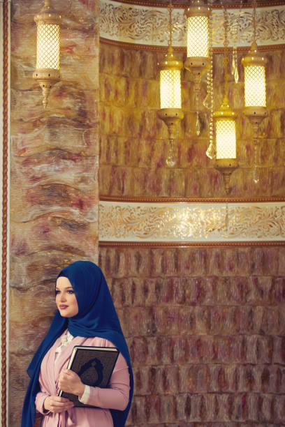 istock muslim woman praying in mosque 875651058