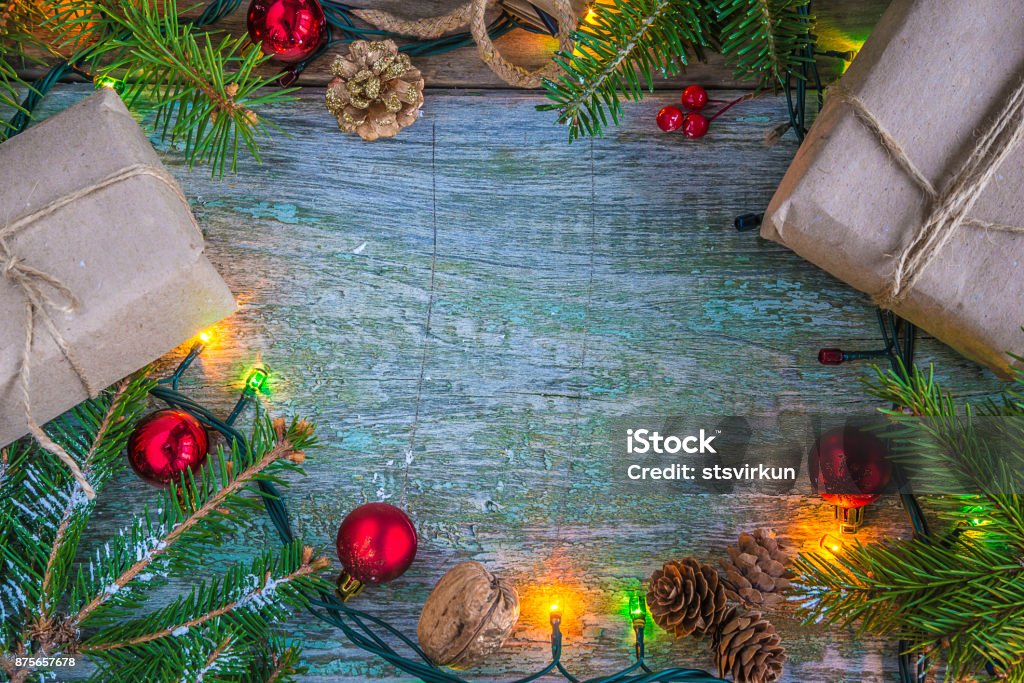 christmas holiday frame gift boxes, fir branches and christmas decoration on rustic backgroune top view with copy space Backgrounds Stock Photo