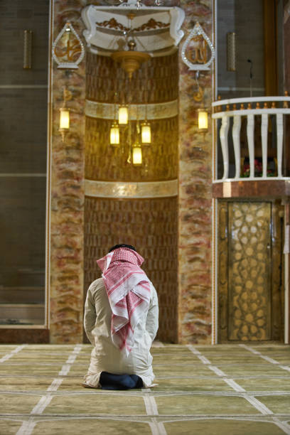istock muslim man praying inside the mosque 875661200