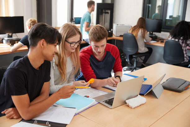 istock Design Students Working In CAD/3D Printing Lab Together 875669098