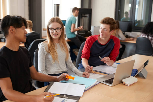 istock Design Students Working In CAD/3D Printing Lab Together 875669170