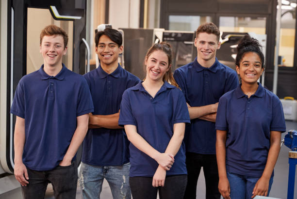 Portrait Of Engineering Apprentices In Factory Portrait Of Engineering Apprentices In Factory trainee photos stock pictures, royalty-free photos & images