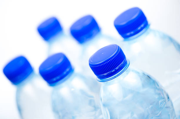 istock Plastic bottles of water isolated on white background 875680374