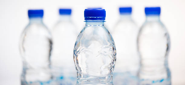 istock Plastic bottles of water isolated on white background 875680742