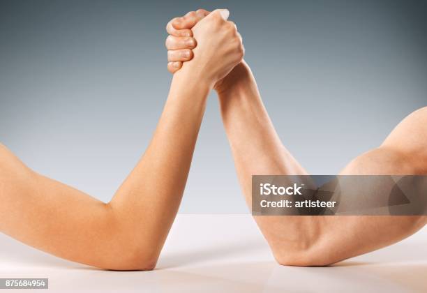 Woman Stock Photo - Download Image Now - Arm Wrestling, Wrestling, Arm