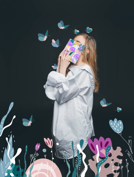 istock girl hiding face by book 875685264