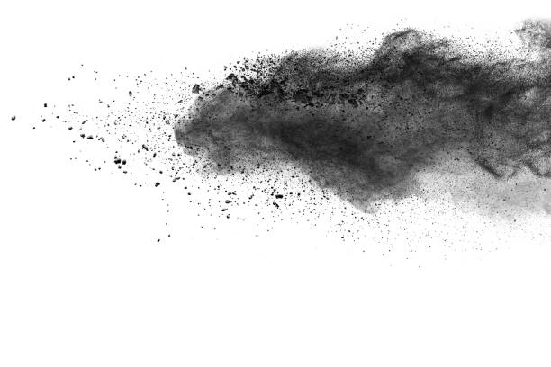 The particles of charcoal splattered on white background The particles of charcoal splattered on white background. Closeup of black dust particles explosion isolated on white background. fumes photos stock pictures, royalty-free photos & images