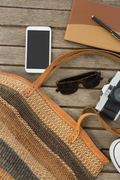 istock Travel accessories on wooden plank 875688858