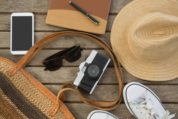 istock Travel accessories on wooden plank 875688872