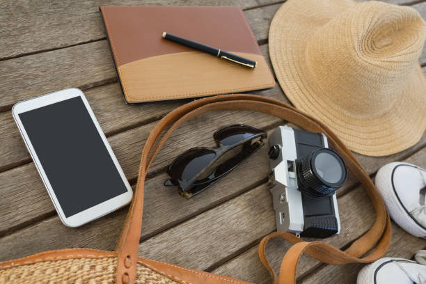 istock Travel accessories on wooden plank 875688934