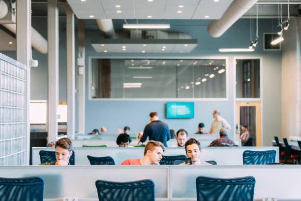 istock Two young men studying, brainstorming or having a business meeting. Startup. Bring your own device area 875689600