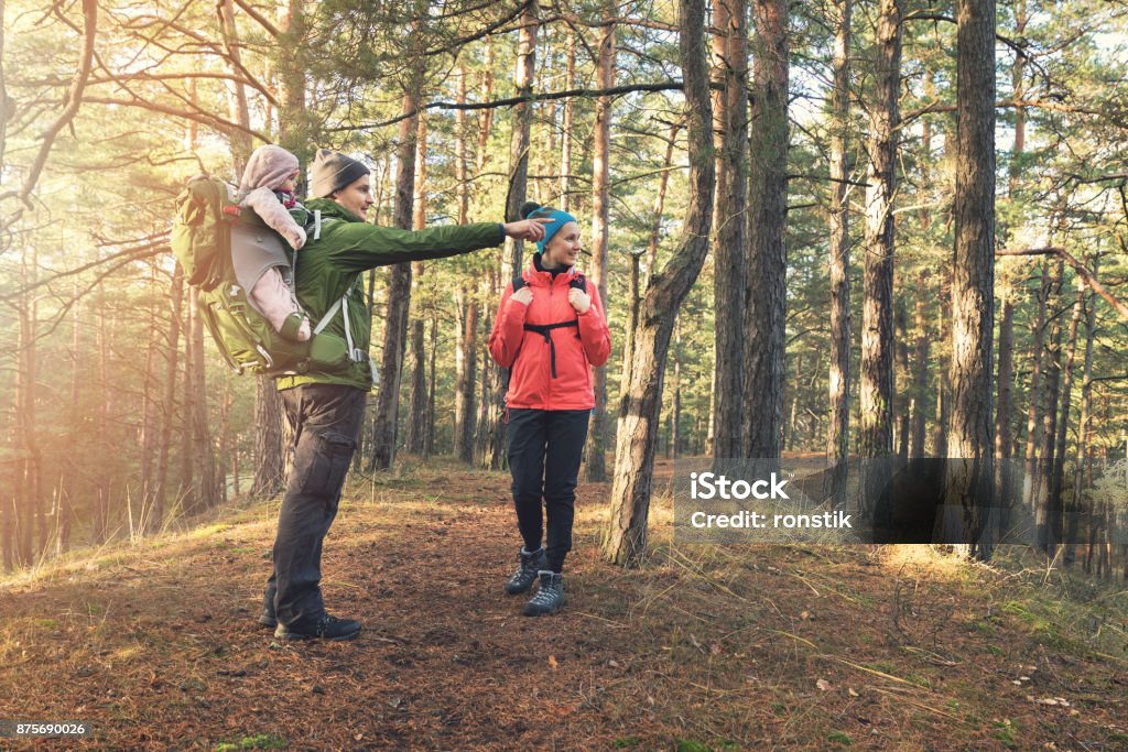 young family on forest hike on sunny autumn day Hiking Stock Photo