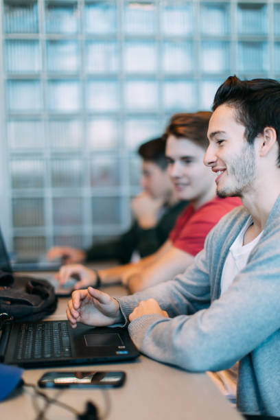 istock Three young men studying, working or having a business meeting. Startup. Bring your own device area 875690106