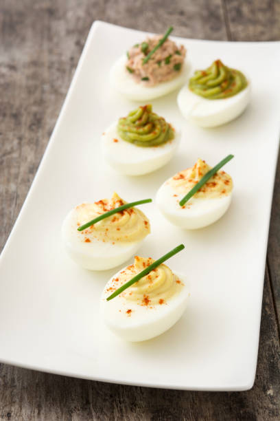 istock Variety of stuffed eggs with tuna and guacamole 875690388