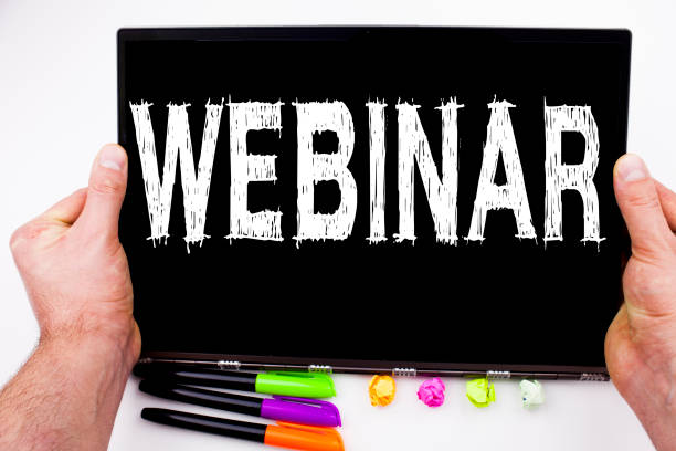istock Webinar text written on tablet, computer in the office with marker, pen, stationery. Business concept for Online Training Development Business Workshop white background with copy space 875693576