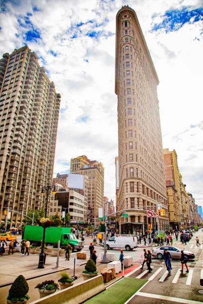istock Flatiron building back lit with flare elevated street scene 875696774