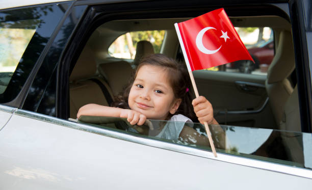 istock Girl Holding Turkish Flag 875697386