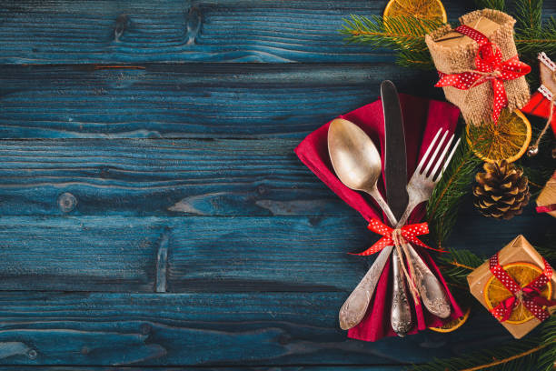istock Christmas serving cutlery with plate on a wooden background. 875700362