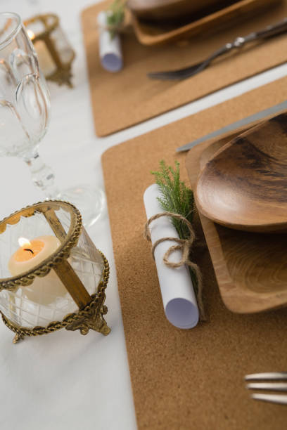 istock Wooden plate and cutlery set on a table 875700658
