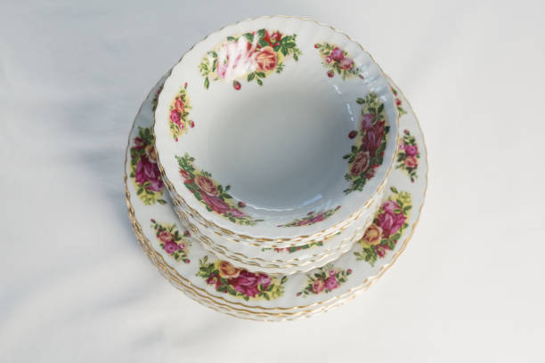 istock Plates and bowl with floral design set elegantly on a table 875703872