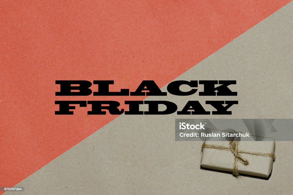 Black friday hot sale.  The inscription is black Friday on craft paper with a bright red insert with a gift, a place for text advertising and banner Black friday hot sale.  The inscription is black Friday on craft paper with a bright red insert with a gift, a place for text advertising and banner. Black Friday - Shopping Event Stock Photo