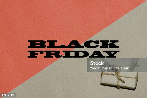 Black Friday Hot Sale The Inscription Is Black Friday On Craft Paper With A Bright Red Insert With A Gift A Place For Text Advertising And Banner Stock Photo - Download Image Now