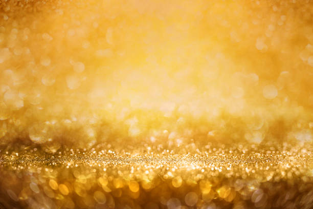 istock Abstract golden glitter bokeh background 875707388