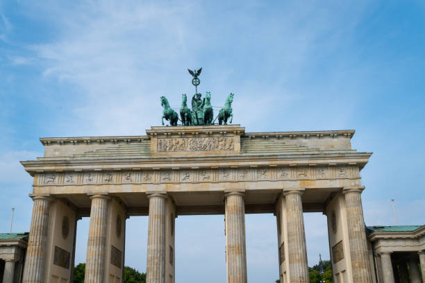 istock bronze statue four hourses pulling chariot on top of the Brandenburg Gate 875707708