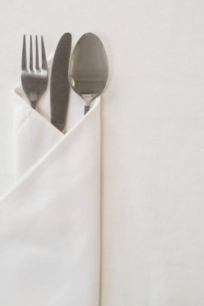 istock Spoon, knife and fork wrapped in a napkin 875710784