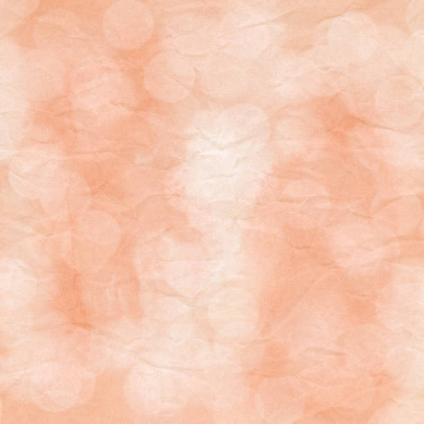 istock Bokeh light on orange crumpled paper 875714898
