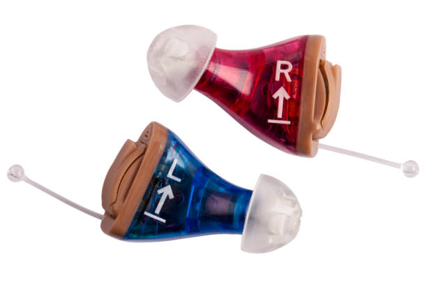 Colorful macro photography image of left and right hearing aids. Canon 5D Mark2, 100 ISO, EF 100mm f/2.8L Macro IS USM lens, studio strobes.