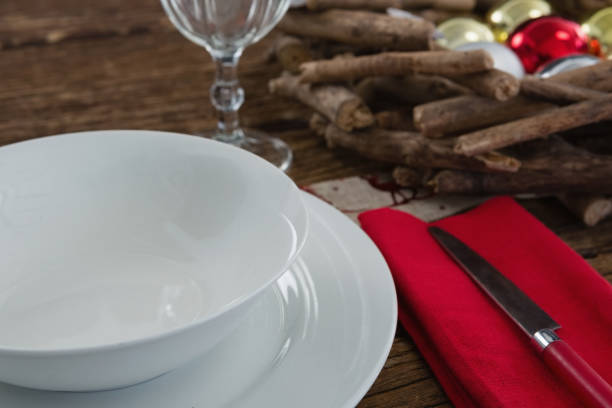 istock Butter knife, napkin with plate and christmas decoration 875720794