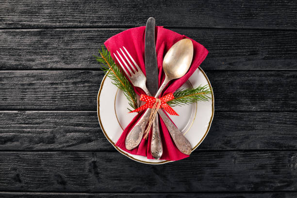 istock Christmas table decoration. Christmas dinner plate, cutlery decorated festive decorations. Winter holidays. Christmas card. Free space for your text. Merry Christmas, Happy New Year. 875722328