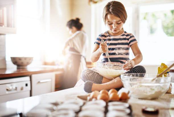 istock She's Mom's special little baker 875722536