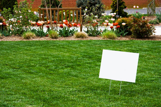 Blank Sign on Lawn Blank white sign on newly cut grass. Copy space. Horizontal. yard sign stock pictures, royalty-free photos & images