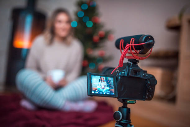 istock Woman vlogging on Christmas eve 875722842