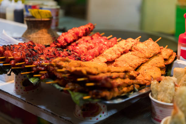 istock Meat On Skewers At Market Stall 875722978
