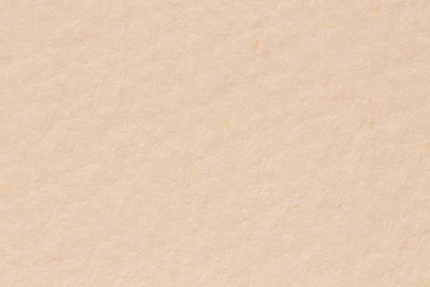 istock Canvas burlap fabric texture background in beige yellow sepia ta 875725490