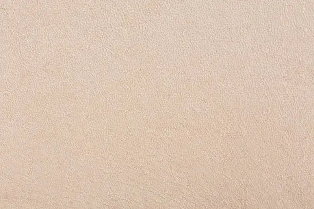 Photo of Bright luxury beige leather background