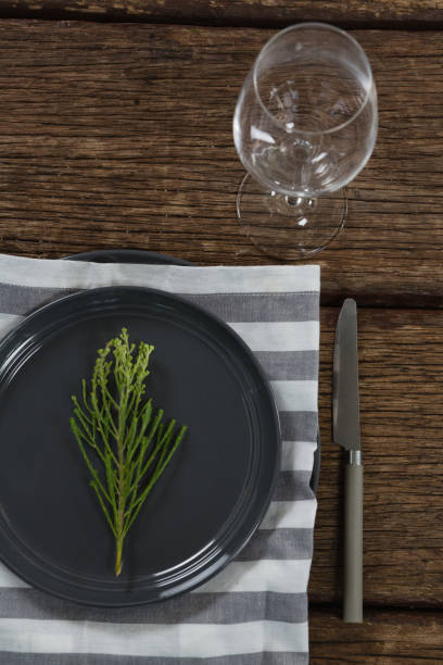 istock Elegance table setting with empty wine glass on wooden plank 875748416