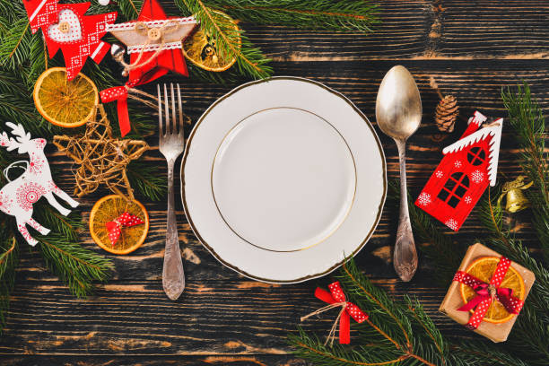 istock Christmas table decoration. Christmas dinner plate, cutlery decorated festive decorations. Winter holidays. Christmas card. Free space for your text. Merry Christmas, Happy New Year. 875748902