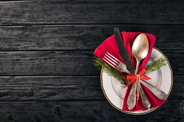 istock Christmas table decoration. Christmas dinner plate, cutlery decorated festive decorations. Winter holidays. Christmas card. Free space for your text. Merry Christmas, Happy New Year. 875751500