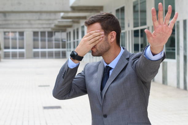 istock Business covering his eyes to avoid reality 875752090