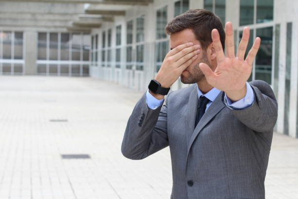 istock Denial concept with businessman covering his eyes 875752092