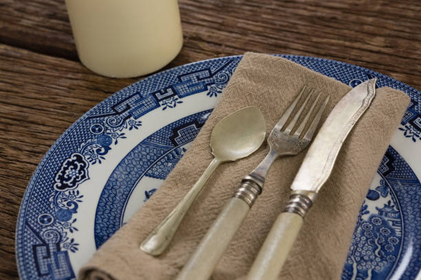 istock Cutlery and napkin on plate 875753554
