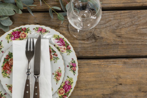 istock Floral pattern plate with cutlery set and wine glass 875755328
